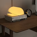 Decorative Ornament Set With Fan Shaped Lamp Alarm Clock And Books On Wooden Table