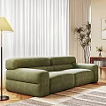 Elegant Green Velvet Sectional Sofa In Living Room With Sheer Curtains And Floor Plants