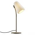 Modern Table Lamp With Curved Metal Stand And Pleated White Shade Emitting Soft Glowing Light
