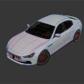 Silver Maserati Sedan With Sleek Design And Black Wheels On Reflective Surface