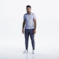 Man Standing in Gray Polo Shirt Dark Pants and White Shoes Casually