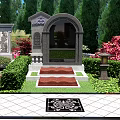Cemetery Scene With Visitors Taking Photos Walking Path Tombstones Red Flowers And Green Trees