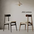 Mid century dining chairs featuring dark and light wooden legs and white padded seats