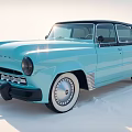 Light Blue Vintage Car With Retro Design Chrome Wheels On White Salt Flat