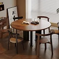 Modern Dining Space With Round Wooden Table Four Chairs Book Tray Bookshelf Artwork And Plant