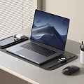 Sleek Laptop Desk Setup With Mouse Phone Smartwatch And Stationery On Pad