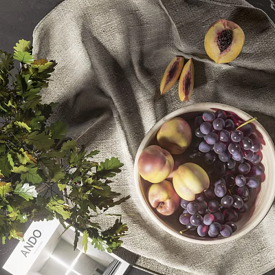 Natural Ceramic Vessel Holding Fresh Grapes Peaches And Green Leaves On Gray Linen 3d model