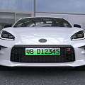 White Sports Car With Open Hood Revealing Engine Compartment Details