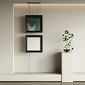 Modern Interior Featuring Hanging Square Geometric Paintings And Green Plant On White Pedestal
