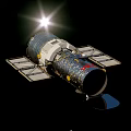 Hubble Space Telescope With Silver Exterior And Solar Panels In Orbit