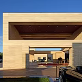 Modern Architectural Courtyard With Pool Statue Grass And Blue Sky