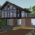 Modern Guesthouse Building With Large Glass Windows Wooden Structure Surrounding Greenery And Water Features