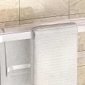 Wall Mounted Bathroom Rack With Transparent Design Golden Fixtures And Hanging Towels On Tile Wall
