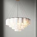 Modern White Layered Chandelier Hanging From Ceiling With Minimalist Design And Soft Light