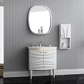 Stylish White Vanity with Oval Mirror Gold Accents and Wall Cabinet in Gray Striped Bathroom