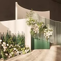 Elegant Event Decoration With Curved White Green Structures And Floral Arrangements