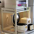 Modern Kitchen Countertop With White Microwave Rice Cooker Olive Oil Bottles And Tea Cups