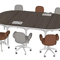 Oval Wooden Conference Table With Metal Frame And Brown Gray Wheeled Chairs