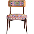 Vibrant Accent Chair With Colorful Patterned Seat Wooden Armrests And Green Throw Blanket