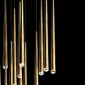 Slender Golden Chandelier with Vertically Hanging Rods in Black Background Modern Design