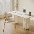 Modern White Desk with Curved Legs Computer Monitor Small Plant Decor Figurine and Accent Chair