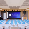 Modern Conference Room With Blue Chairs White Tables Large Screen Windows 10 And Wooden Decor