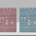 Delicate Pearl Gold Jewelry Collection With Necklaces Earrings Rings On Pink Blue Trays