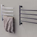 Wall Mounted Bathroom Towel Racks in Silver and Black with Gray Towel on Gray Wall