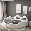 Round White Double Bed in Bedroom with Gray Wall Framed Pictures and Pendant Lights