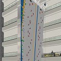 Indoor Rock Climbing Wall In Multi Story Building With Colorful Holds And Balconies