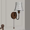 Classic Wall Lamp With Wooden Base Metal Bracket And Floral Lampshade Mounted On Wall