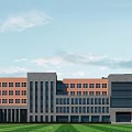 School Campus Buildings Including High Rise Teaching Tower Athletic Stadium And Green Surrounding Trees