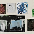 Colorful Wall Art Display With Various Paintings Including Portrait And Abstract Designs