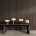 Four Metallic Brass Modern Minimalist Table Lamps on Dark Wooden Table with Wooden Wall
