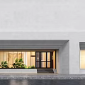 Modern Minimalist Dessit Storefront Featuring Light Gray Large Wall Glass Door And Green Plants