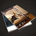 Stacked Magazines With Cover Featuring Woman Sitting on Bed Interior Scene