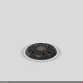Black Circular Mechanical Component With Central Mesh Panel And Outer Gear Like Structure