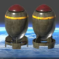 Two Metal Bombs With Red Tops And Yellow Stripes On Stands