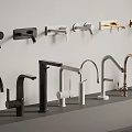 Various Modern Faucet Styles In Different Colors Displayed On Wall And Countertop