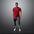 Man Wearing Red Vest Grey Capri Pants White Sneakers with Hands in Pockets