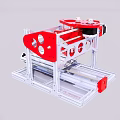 Red And White Industrial Equipment Metal Frame With Circular Holes And Mechanical Components On Workbench