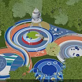 Colorful Outdoor Kids Playground With Slides Circular Areas Tower Structure And Green Trees