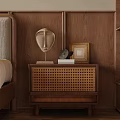Wooden Nightstand With Woven Texture Abstract Face Sculpture And Books On Wooden Wall
