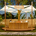 Camping Site With Wooden Bar Counter Cups Drinks Greenery Trees Bamboo Fence And Blue Sky