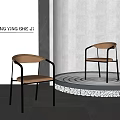 Modern Leisure Chair with Brown Cushion Black Metal Frame Round Platform and Gray Wall