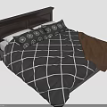 Two People Relaxing On Bed With Checkered Quilt Pillows And Brown Blanket