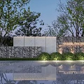 Grace Mansion Landscape Feature Wall With Stone White Panels Trees Lighting And Water Reflection