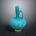 Artistic Carved Blue Vase With Intricate Decorative Patterns And Curved Handle Design