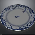 Intricate Sculptural Carving On Blue And White Ceramic Plate With Traditional Patterns