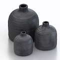 Three Black Clay Pot Vases With Textured Surface In Various Sizes On White Background 3d model
